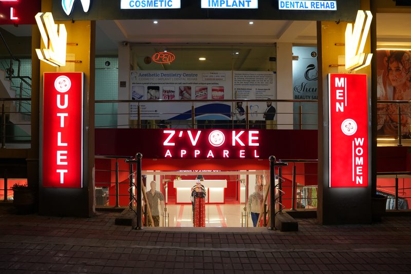 The lit shopfront of Z’Voke Apparel, Bahria Town, Islamabad.